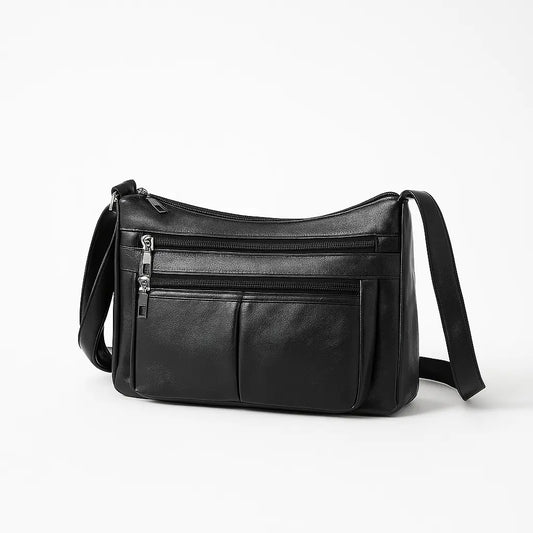 Sac bandoulière en cuir noir IRIS, vue de face en studio.