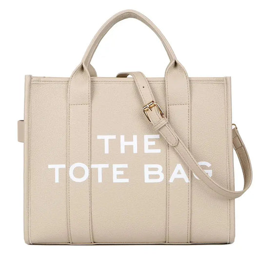 Tote bag beige avec inscription "THE TOTE BAG" – modèle tendance